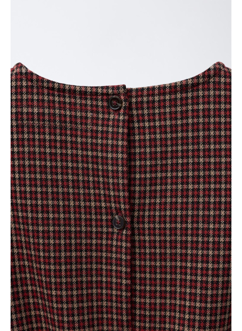 Шорты-комбинезон с клетчатым узелком Шорты-комбинезон с клетчатым узелком