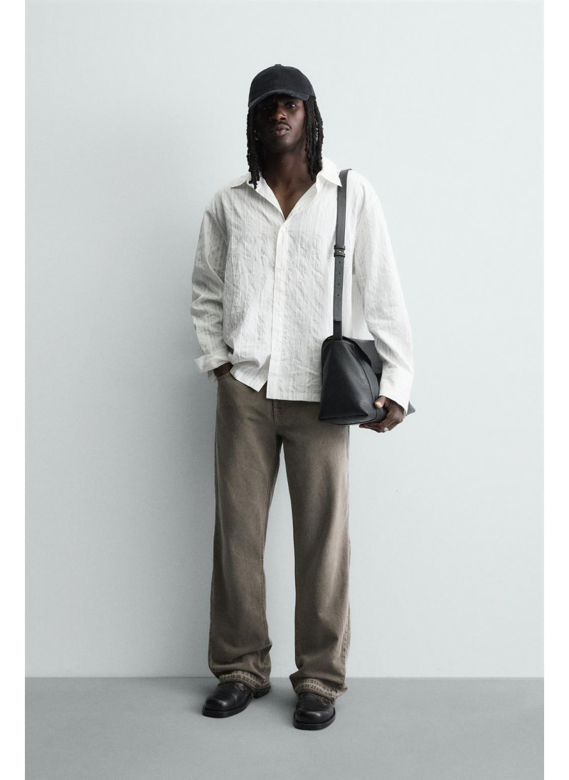 Джинсы с расклешенными брю�...