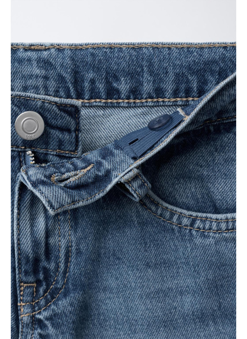 Джинсы с широкими штанинами и нашивкой с животным принтом Джинсы с широкими штанинами и нашивкой с животным принтом