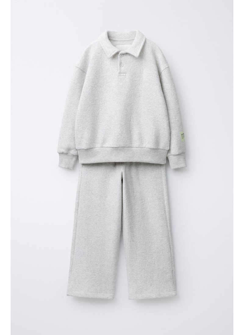 Набор поло и широких брюк с текстурой Набор поло и широких брюк с текстурой