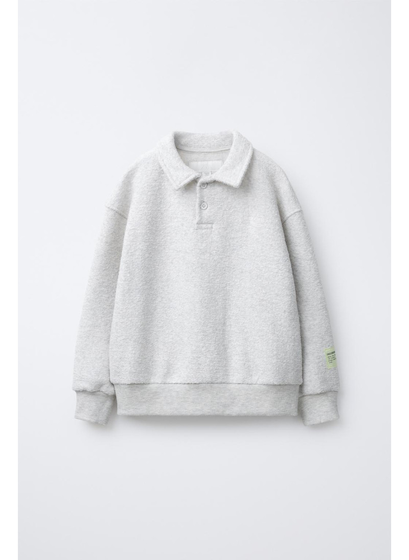 Набор поло и широких брюк с текстурой Набор поло и широких брюк с текстурой