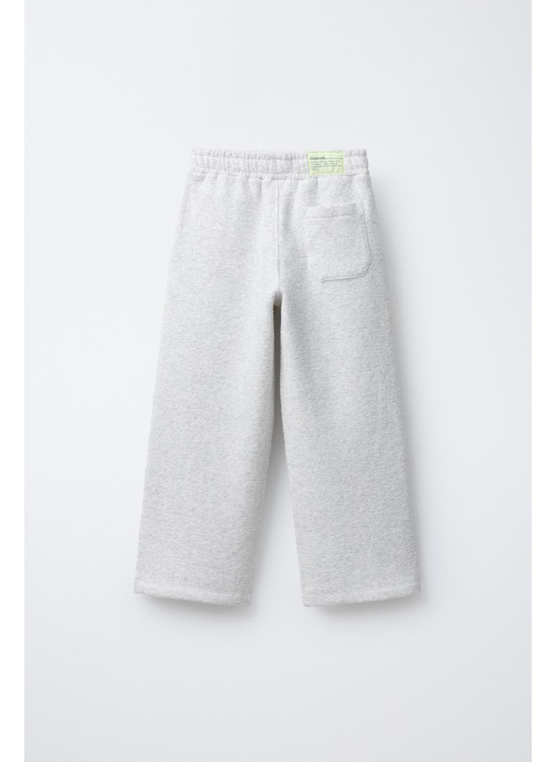 Набор поло и широких брюк с текстурой Набор поло и широких брюк с текстурой