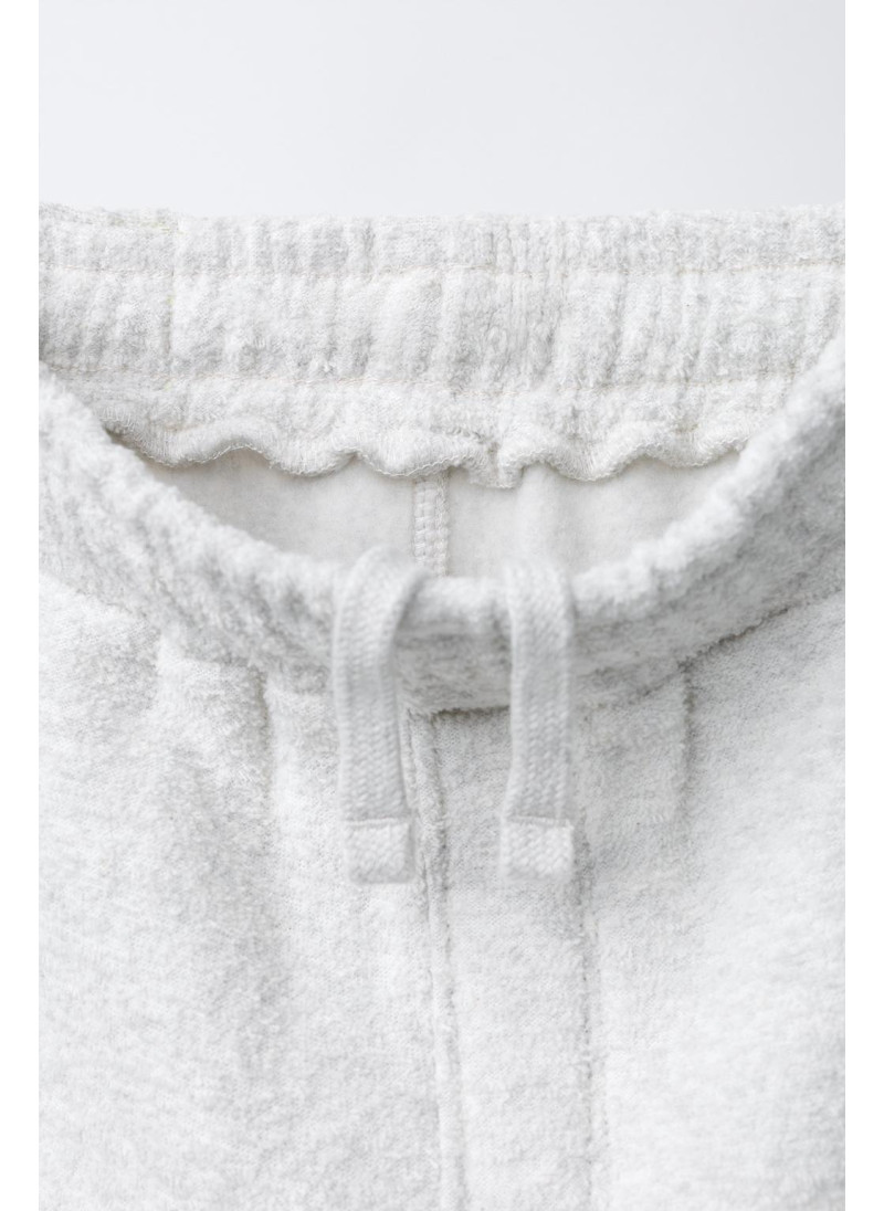 Набор поло и широких брюк с текстурой Набор поло и широких брюк с текстурой