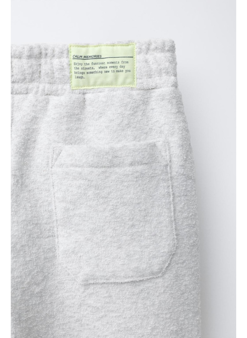 Набор поло и широких брюк с текстурой Набор поло и широких брюк с текстурой