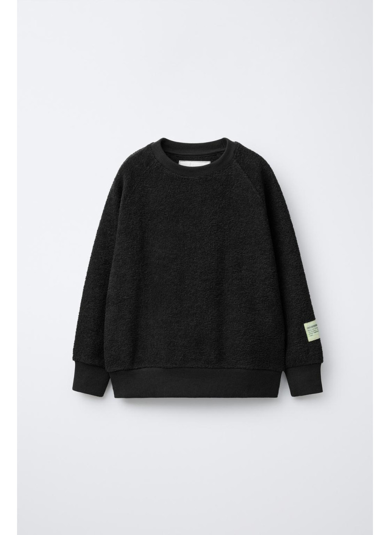 Костюм из свитшота и широких брюк с текстурой ярлыка Костюм из свитшота и широких брюк с текстурой ярлыка