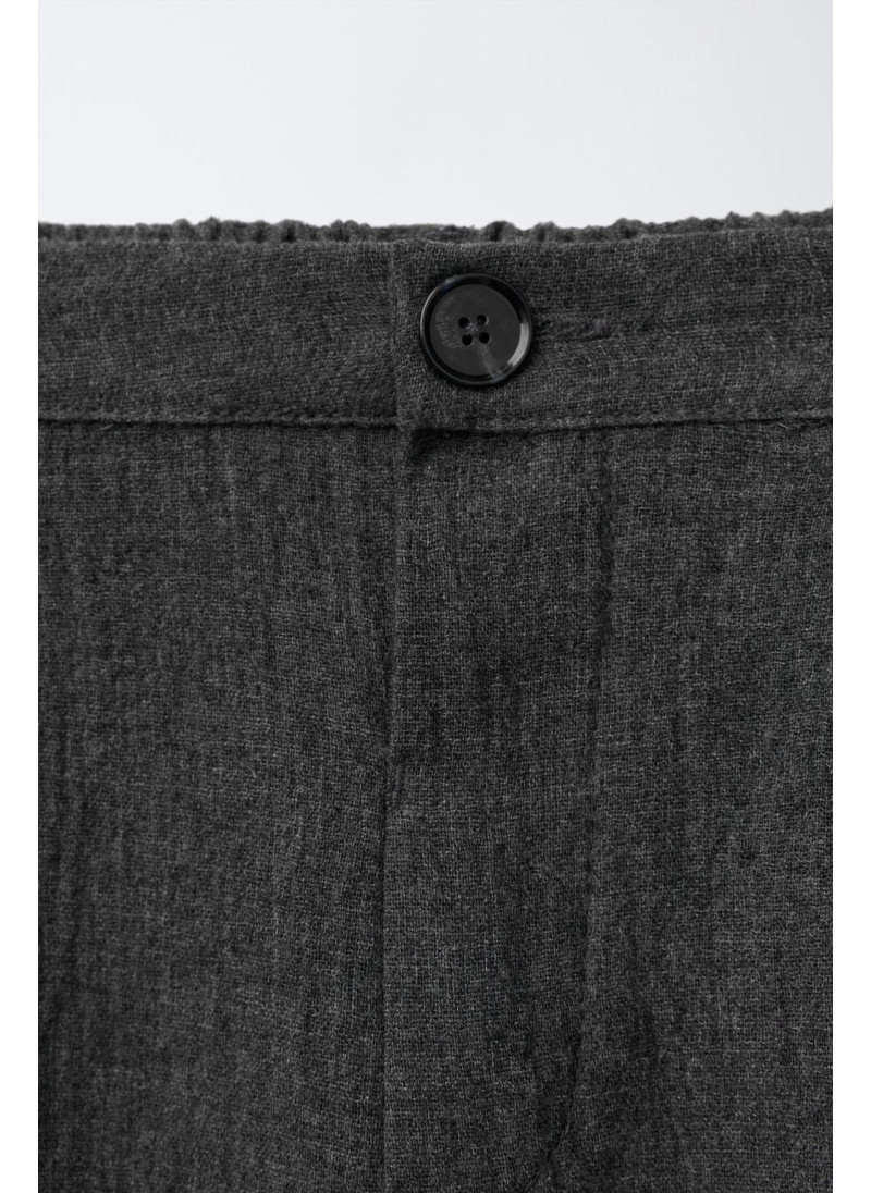 Текстурированные брюки с защипами Текстурированные брюки с защипами