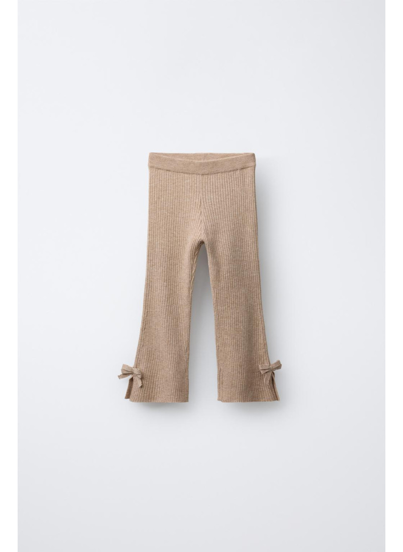 РАСКЛЕШЕННЫЕ ТРИКОТАЖНЫЕ ЛЕГИНСЫ С БАНТИКАМИ РАСКЛЕШЕННЫЕ ТРИКОТАЖНЫЕ ЛЕГИНСЫ С БАНТИКАМИ