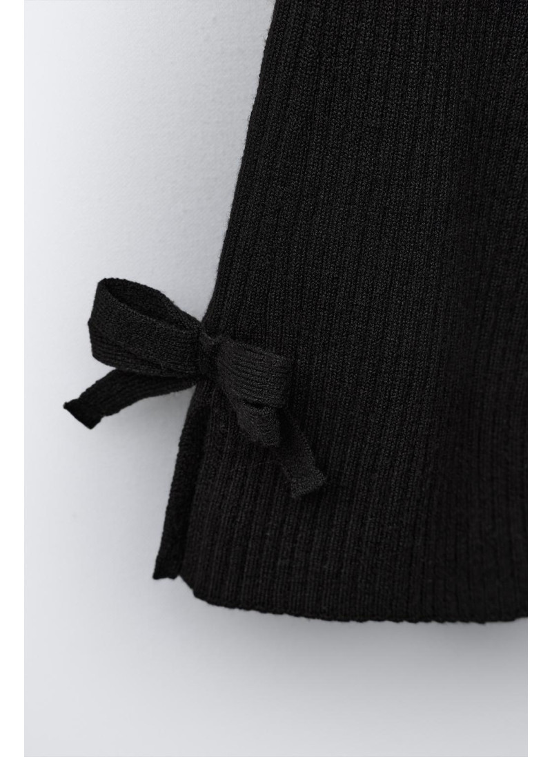 РАСКЛЕШЕННЫЕ ТРИКОТАЖНЫЕ ЛЕГИНСЫ С БАНТИКАМИ РАСКЛЕШЕННЫЕ ТРИКОТАЖНЫЕ ЛЕГИНСЫ С БАНТИКАМИ