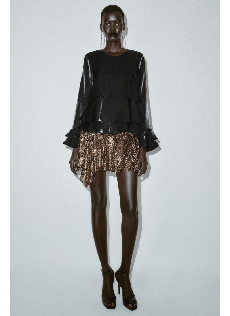 Блузка из блестящей ткани с...