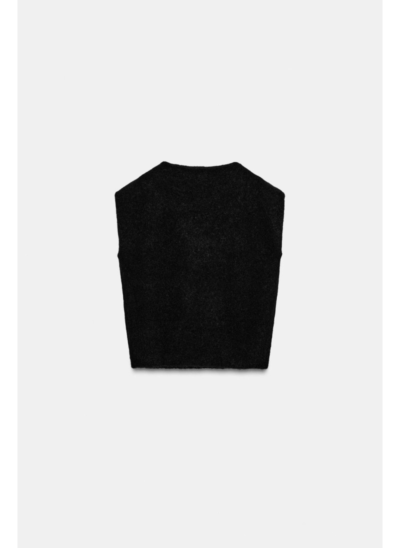 Безрукавный трикотажный свитер с брошью Безрукавный трикотажный свитер с брошью