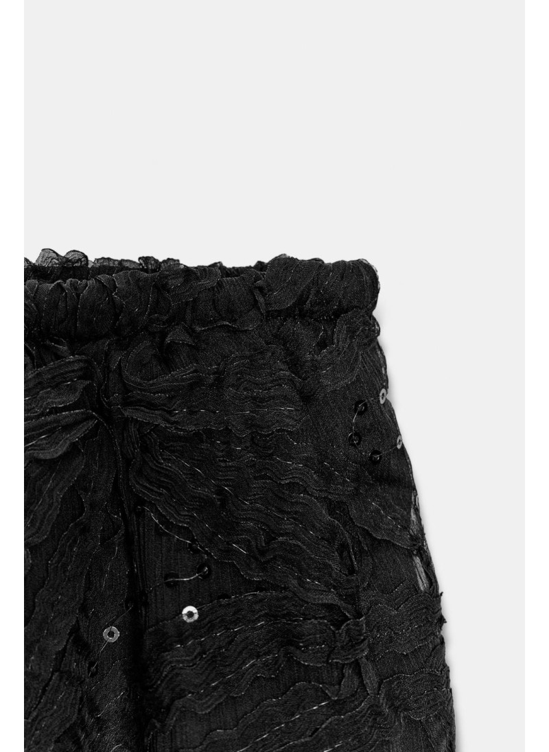 Брюки с пайетками в стиле баллон Брюки с пайетками в стиле баллон