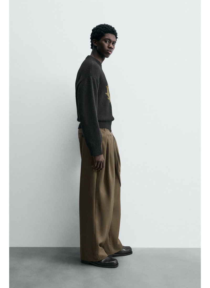 Лимитированная коллекция драпированных перекрещенных брюк Лимитированная коллекция драпированных перекрещенных брюк