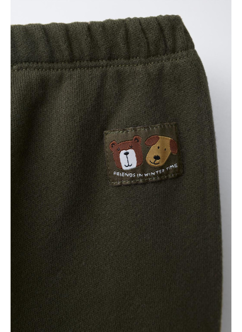 БРЮКИ-ДЖОГГЕРЫ С ЭТИКЕТКОЙ БРЮКИ-ДЖОГГЕРЫ С ЭТИКЕТКОЙ