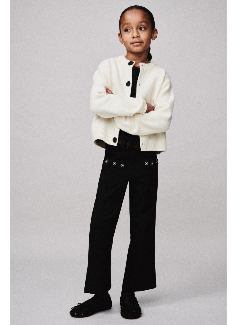 Брюки с цветочными деталям�...