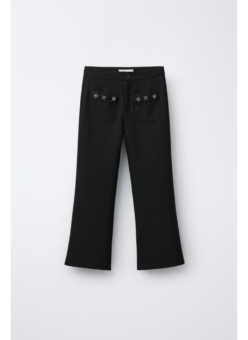 Брюки с цветочными деталями на замке Брюки с цветочными деталями на замке