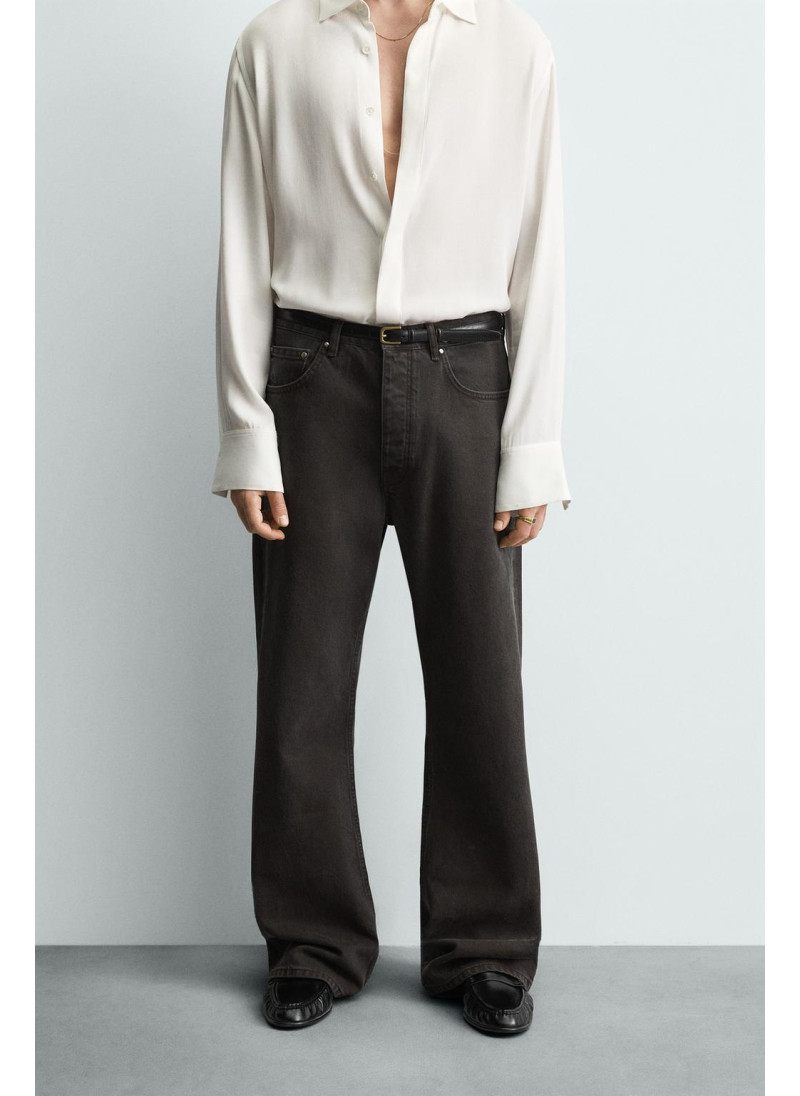 Джинсы с расклешенными штанинами и восковым покрытием Джинсы с расклешенными штанинами и восковым покрытием