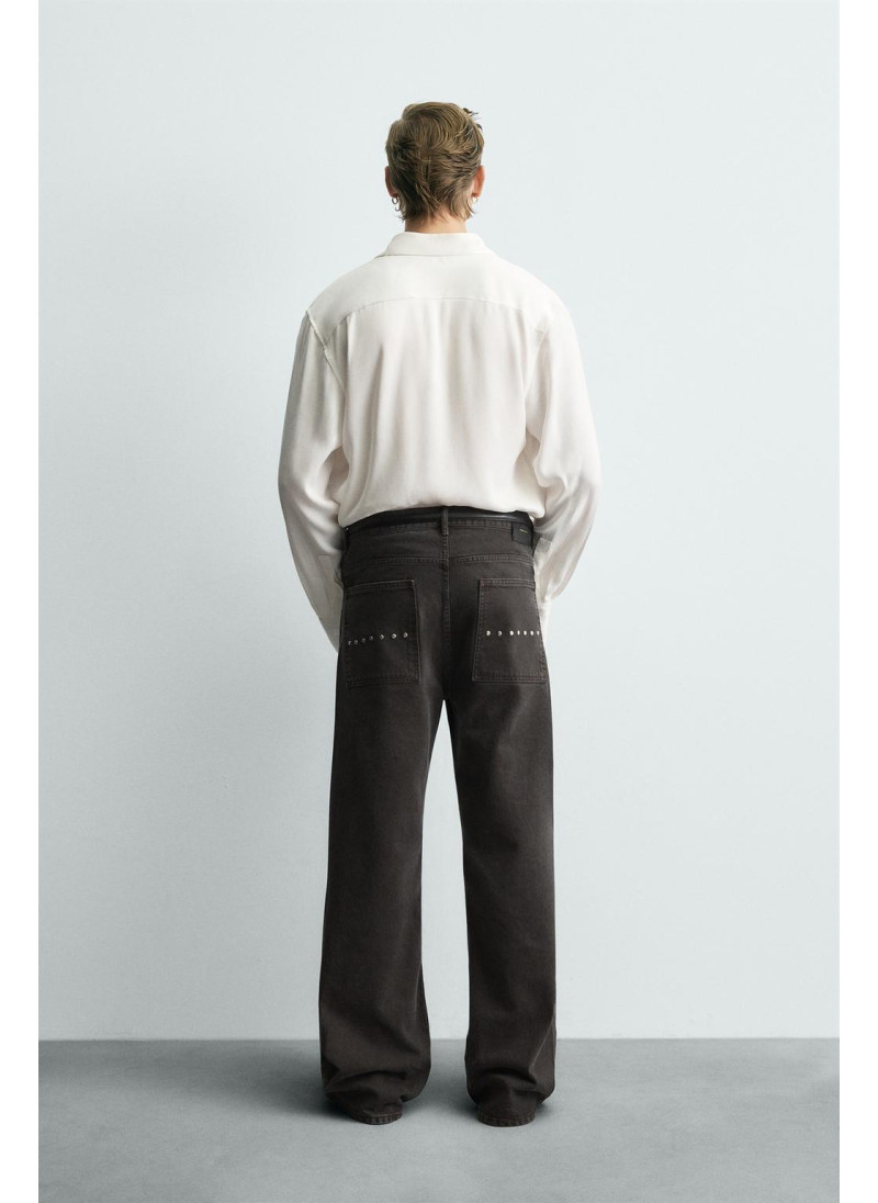 Джинсы с расклешенными штанинами и восковым покрытием Джинсы с расклешенными штанинами и восковым покрытием