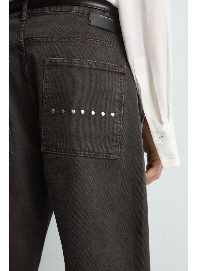 Джинсы с расклешенными штанинами и восковым покрытием Джинсы с расклешенными штанинами и восковым покрытием