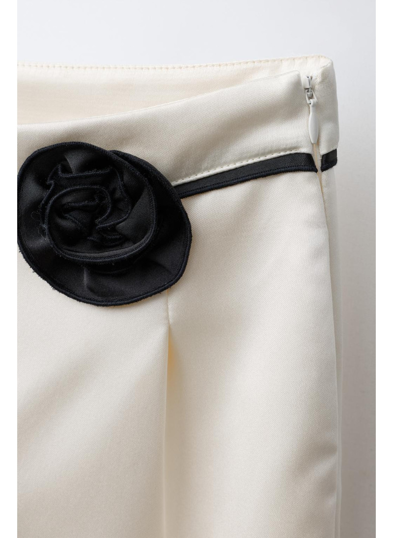 Брюки sarouel с цветочным аппликацией Брюки sarouel с цветочным аппликацией