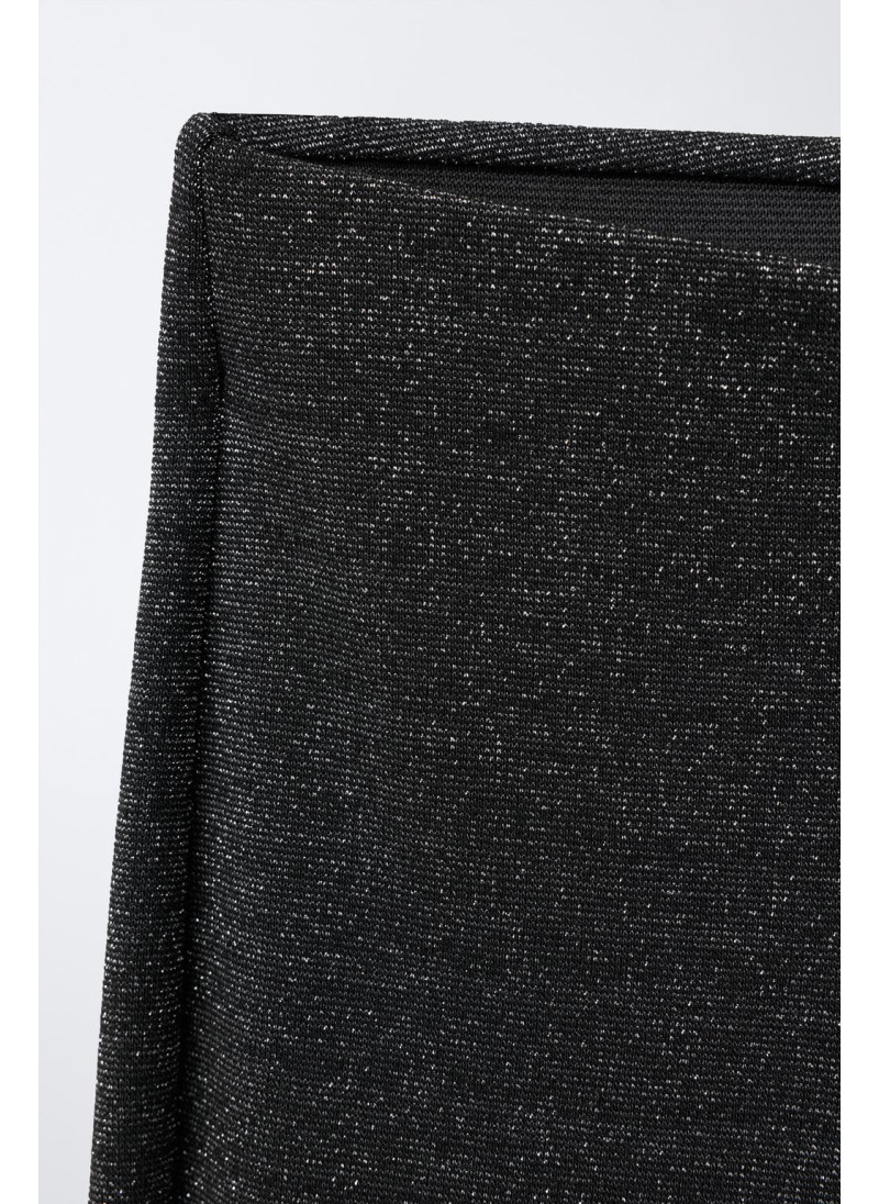 Блестящие леггинсы с расклешенным низом Блестящие леггинсы с расклешенным низом